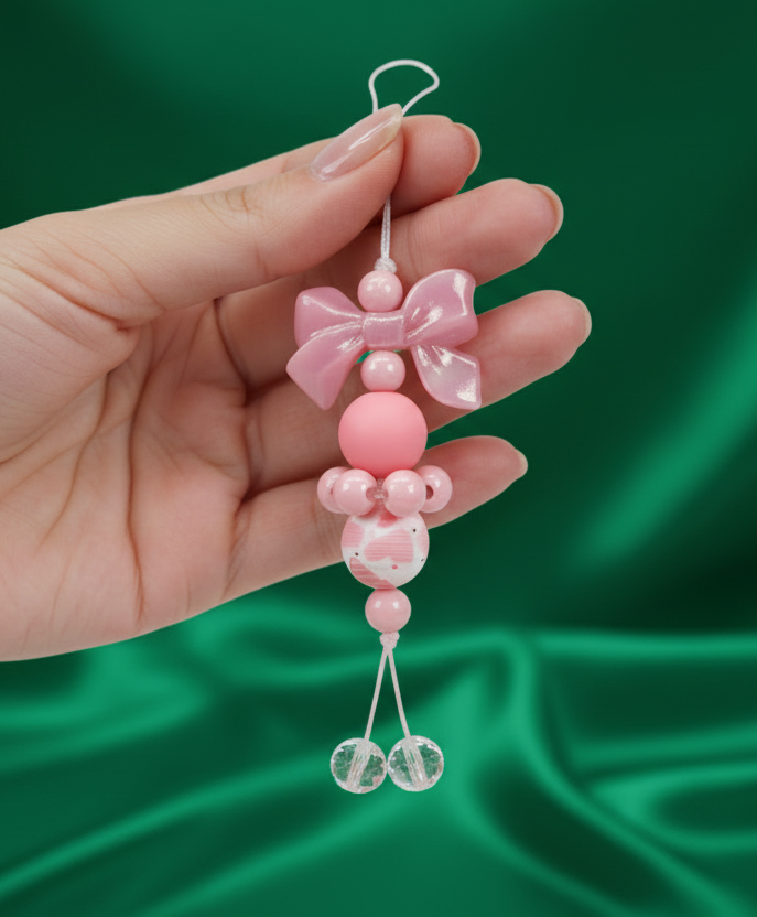 Pink beaded charm with a bow